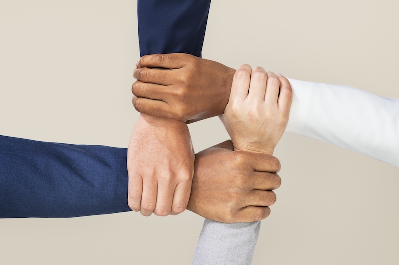 Diverse hands united business teamwork gesture ร่วมงานกับเรา